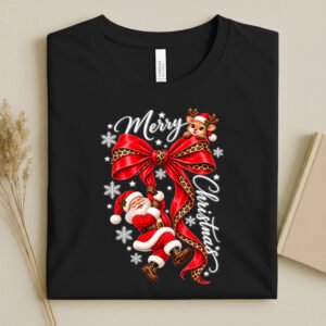 Bella Canvas Black T-Shirt with a Santa Claus climbing a red ribbon and with the words Merry Christmas