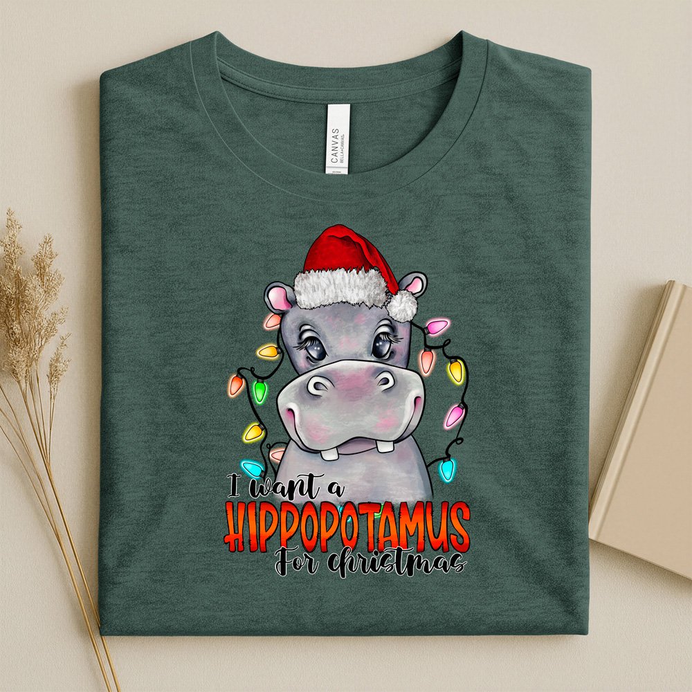 Bella Canvas Heather forest green t-shirt with a christmas hippo design and text I want a hippopotamus for Christmas