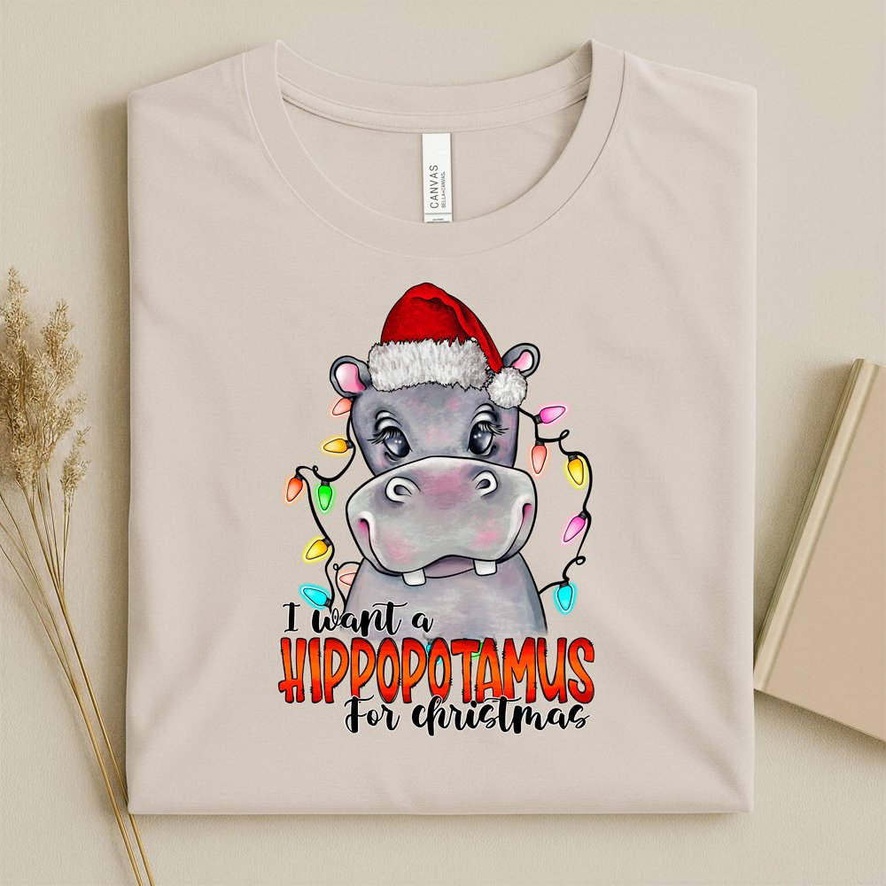 Bella Canvas Soft Cream Color t-shirt with a christmas hippo design and text I want a hippopotamus for Christmas